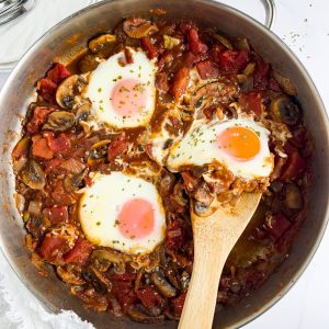 Finish dish of mushroom shakshuka in skillet.
