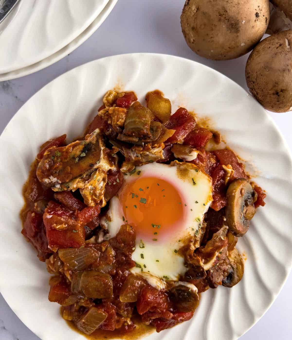 Finish dish of shakshuka in a small plate.