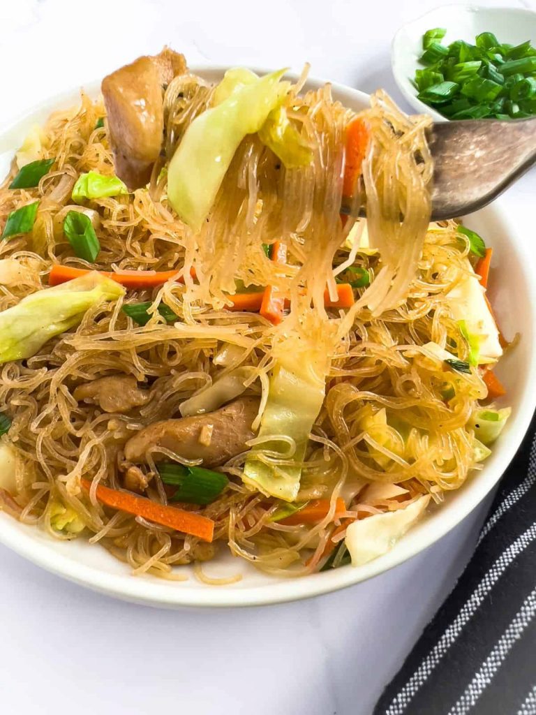 Delicious ancit bihon in a fork.