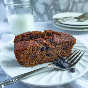 Paleo Pumpkin Banana Bread slices on a white plate.