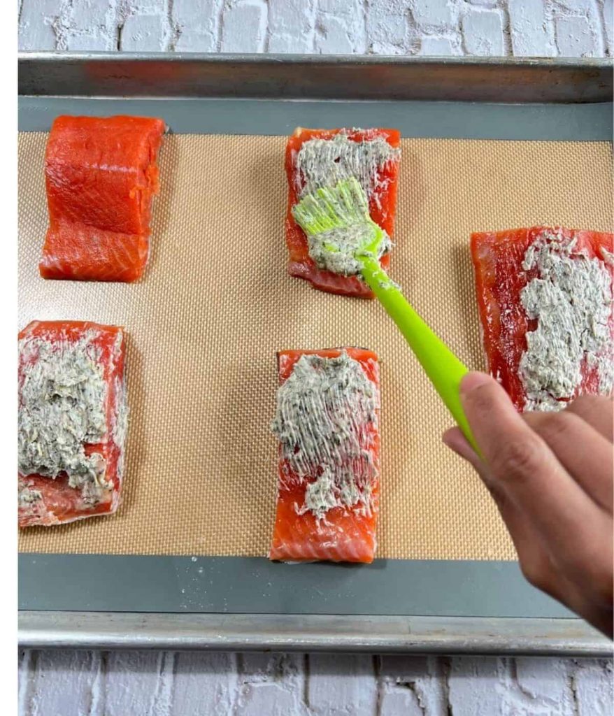 Brushing salmon with mixture
