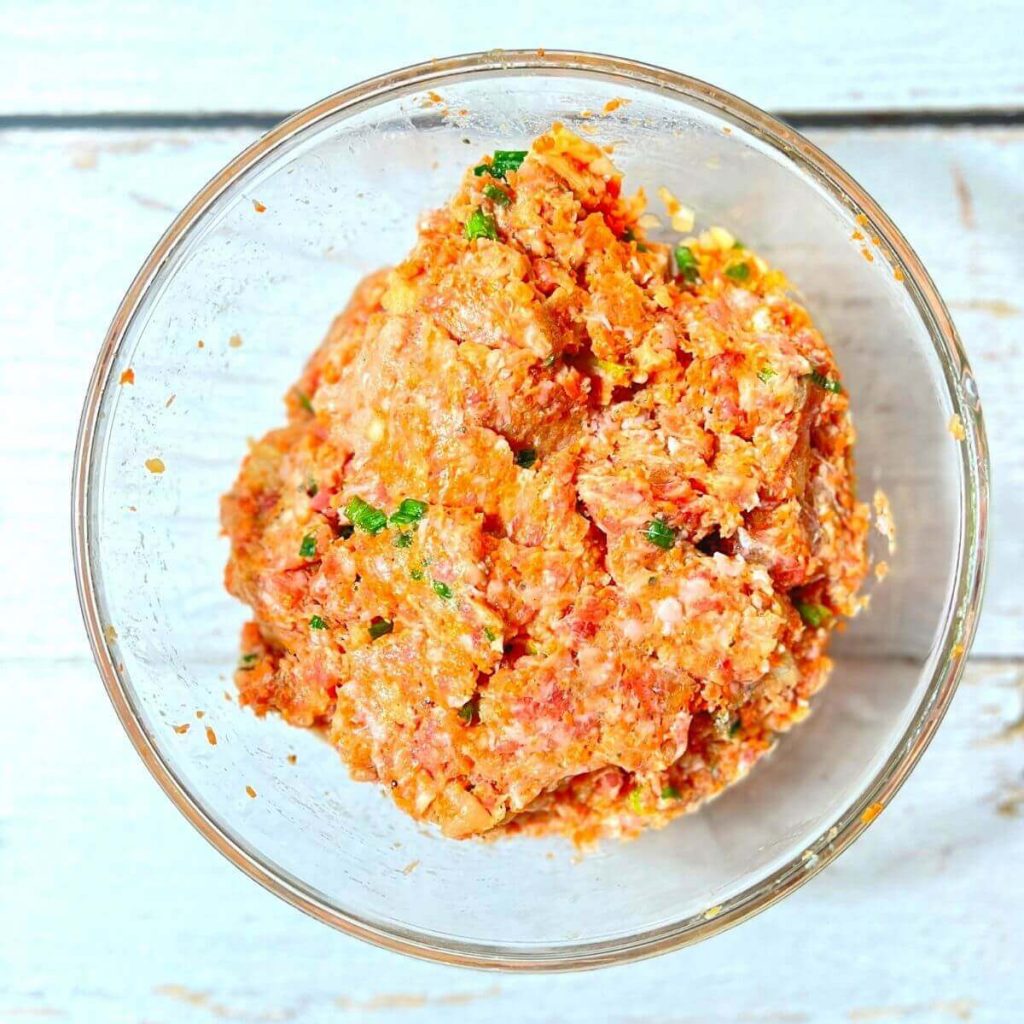 Bowl mixture of meatball ingredients
