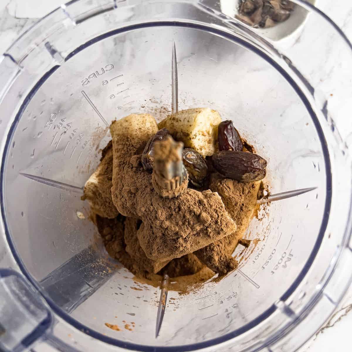 Ingredients for chocolate nice cream in a blender.