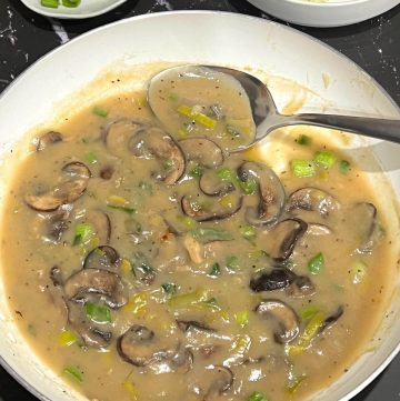 Mushroom gravy in skillet.