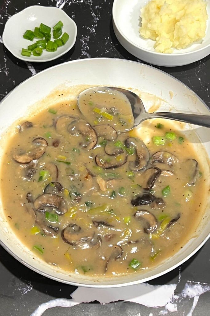 Mushroom gravy in skillet.