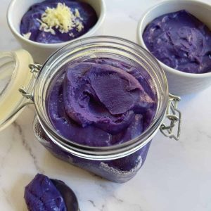 Ube halaya in a glass jar, ramiken and spoon.