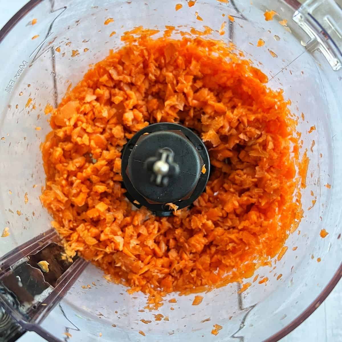 Carrots in a food processor.