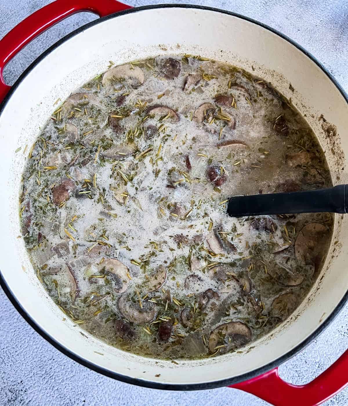 Cooked creamy vegan mushroom soup.
