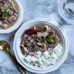 Pork Bicol Express on a plate with rice.