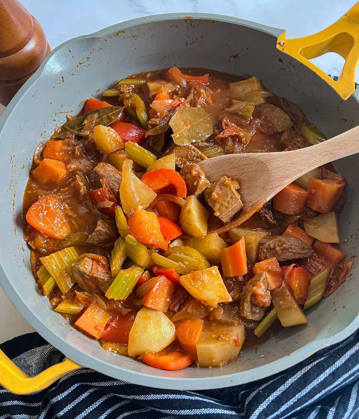 Beef stew in skillet.