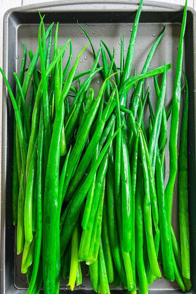 Green onions on a tray.