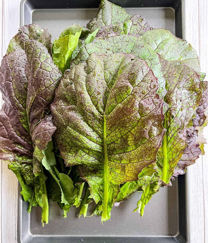 Mustard greens on a table.
