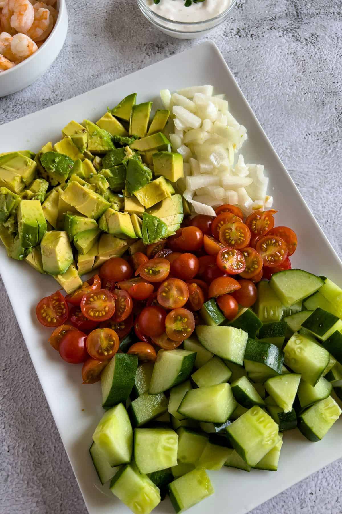 Chopped fruits and vegetables for the salad.