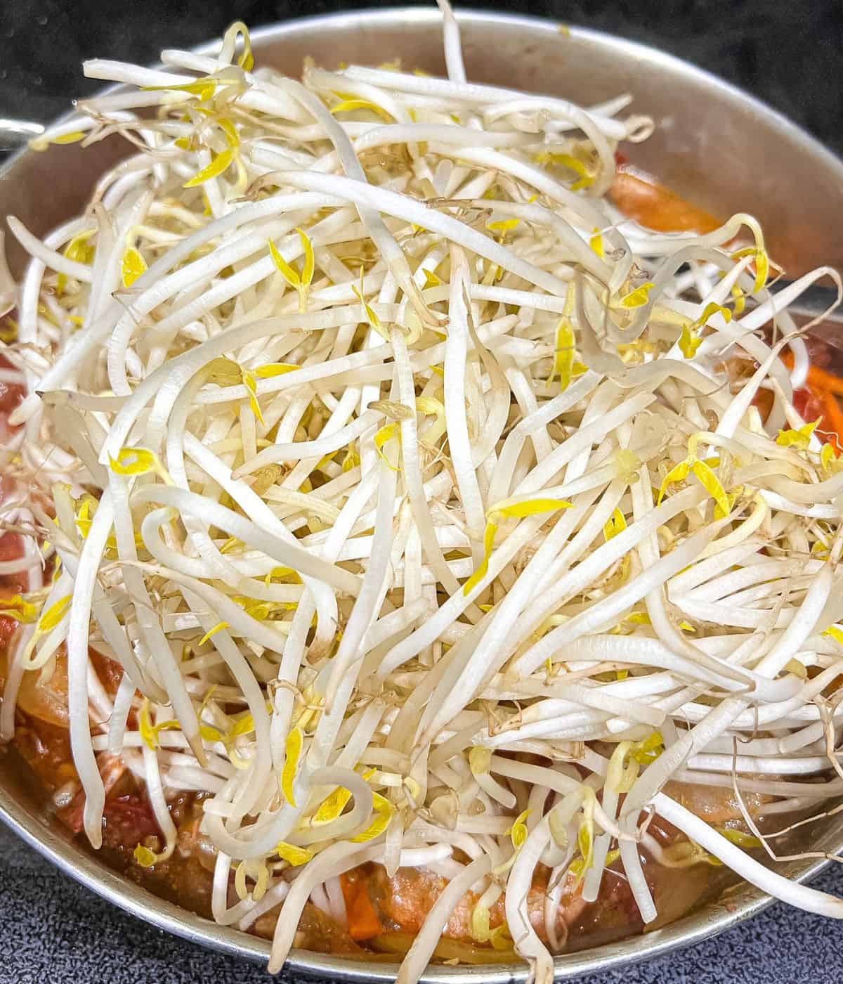 Adding mungbrean sprouts.