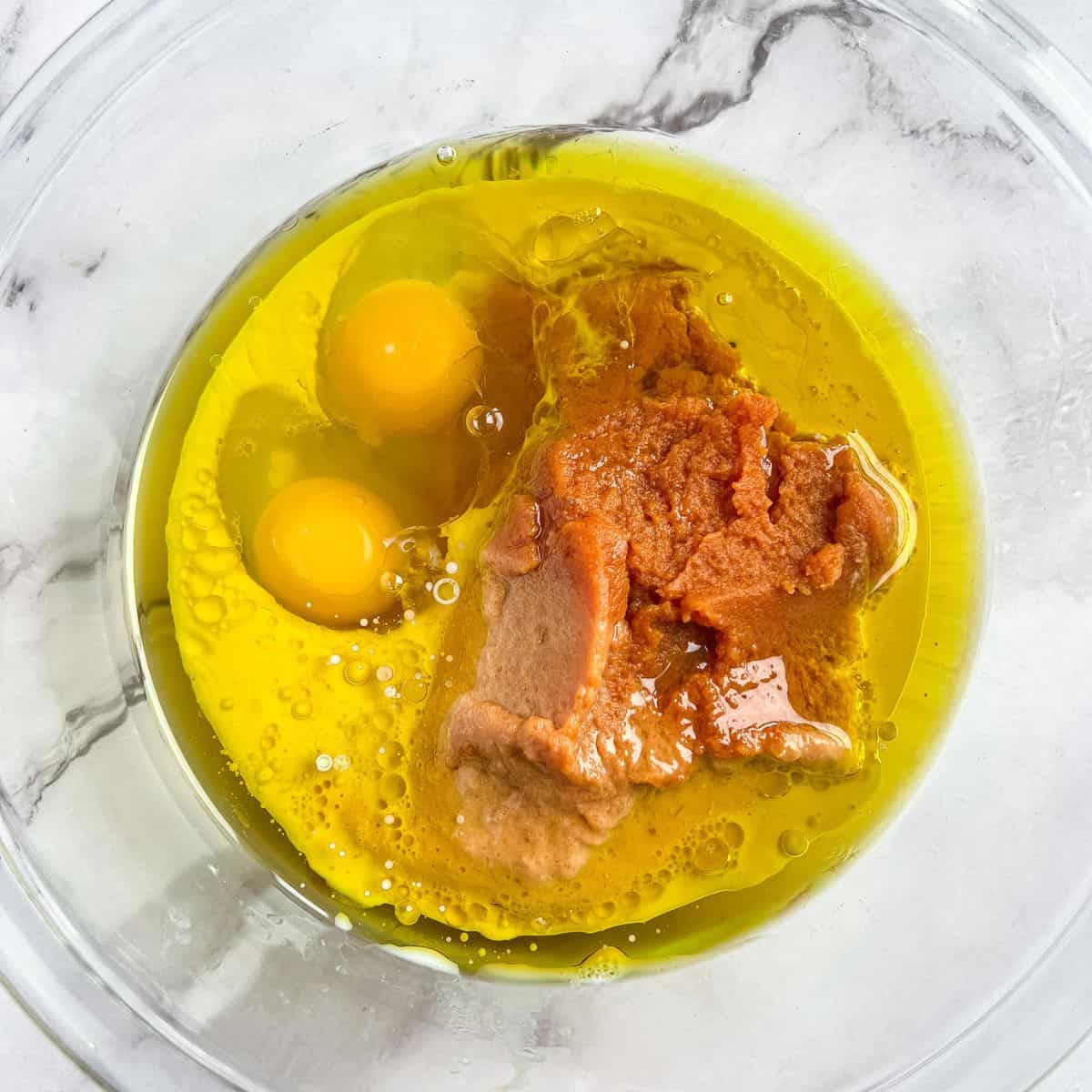 Combining ingredients for pumpkin bread.