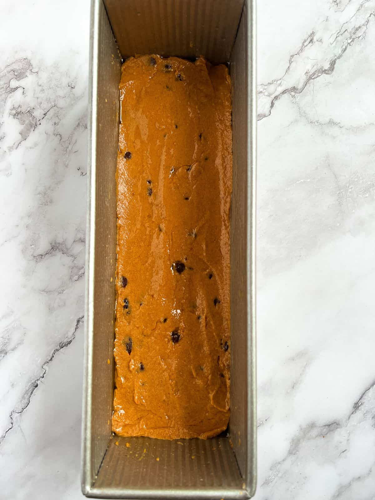 Transfer pumpkin bread mixture into a loaf pan and bake.