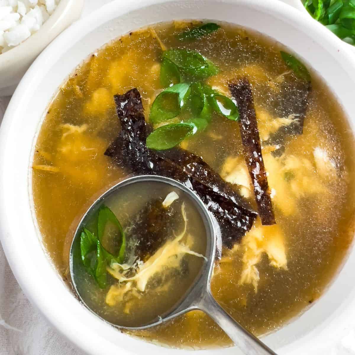 Delicious seaweed soup on a spoon.