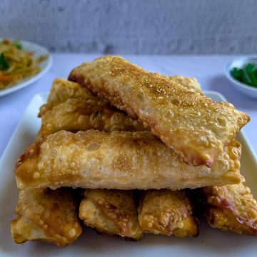 Finish dish of crab rangoon egg rolls on a plate.