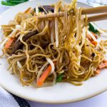 Finish dish of cantonese chow mein noodles on the table.