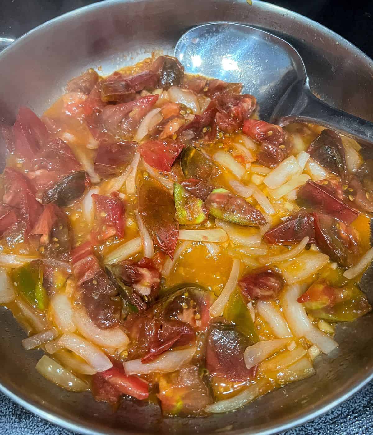 Saute garlic and onion then tomatoes.