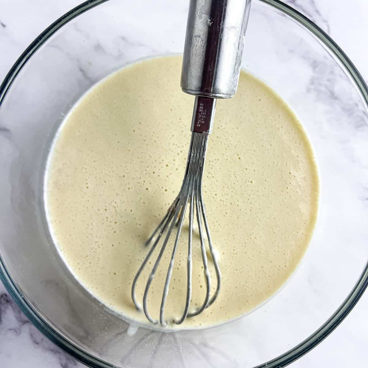 Puto mixture with dry and wet ingredients combined.