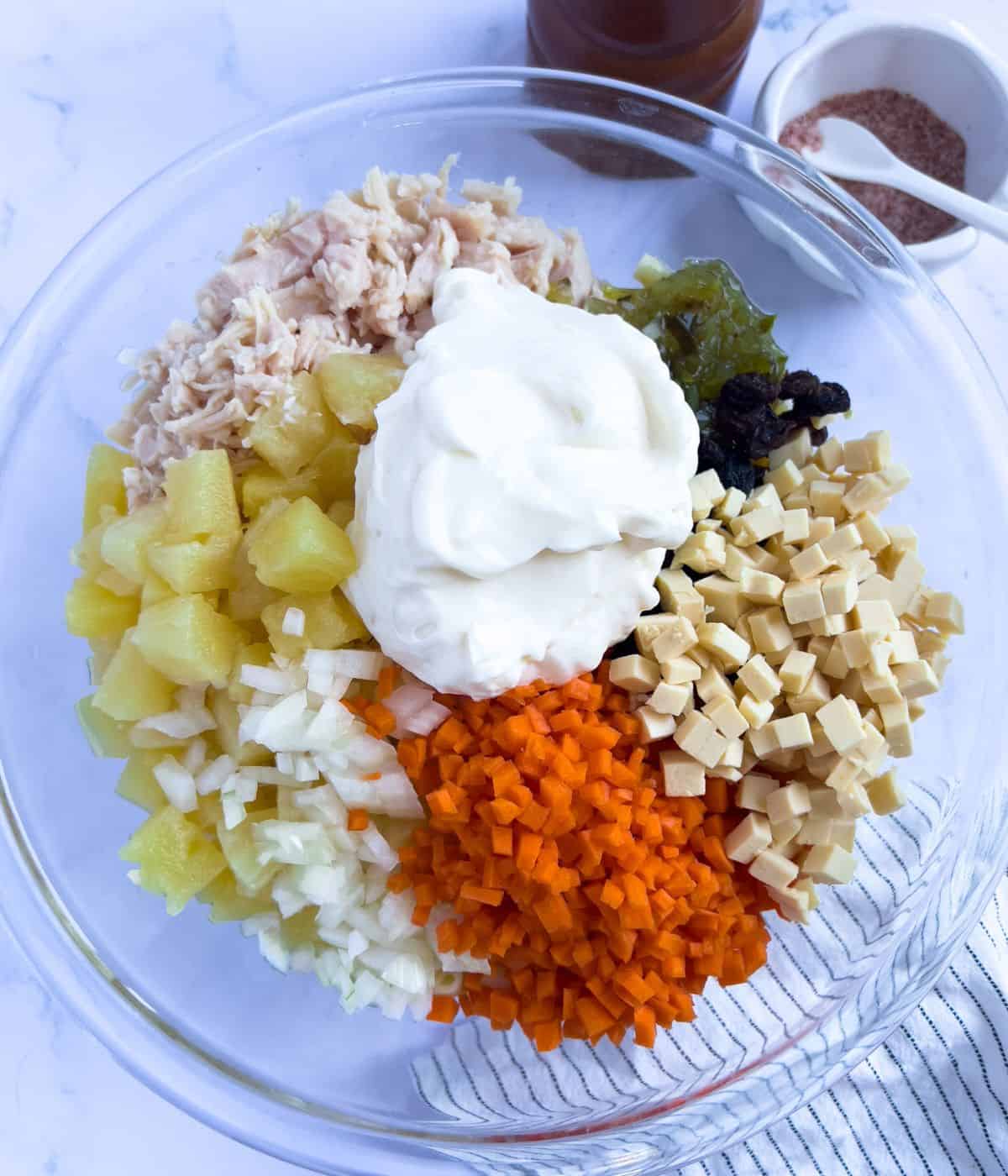 Combining all the ingredients to make pinoy style macaroni salad.