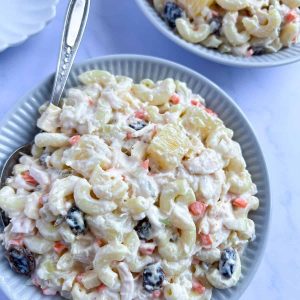 Filipino macaroni salad dessert on the table with spoon.