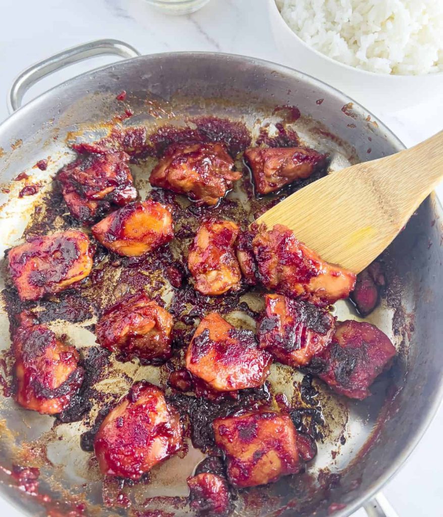 Frying chicken tocino until nicely brown and tender.