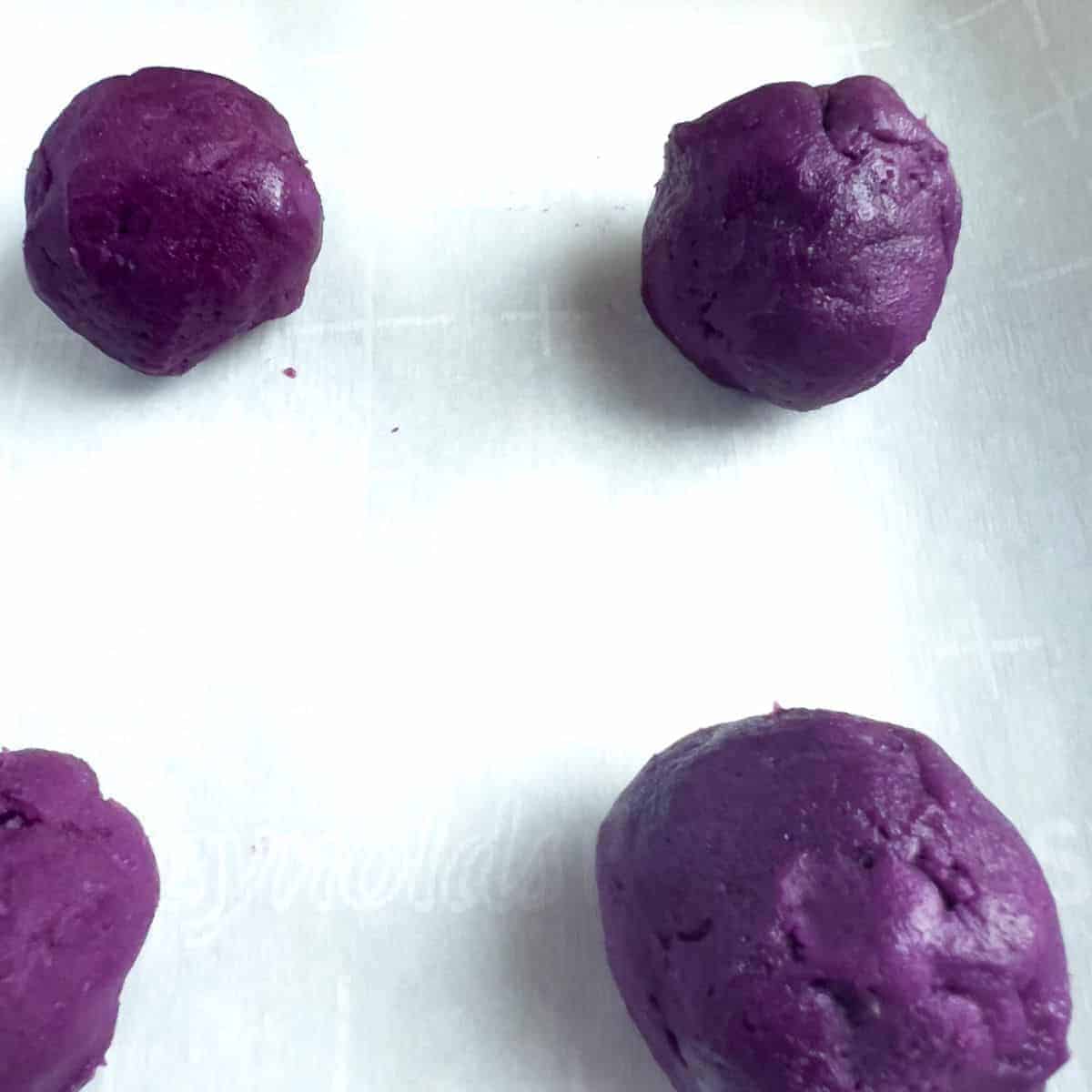 Cookie dough in an oven tray, ready to bake.