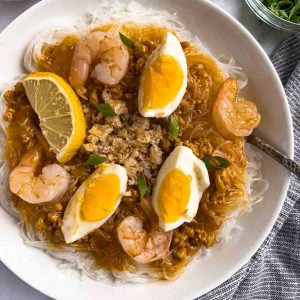 Finish dish of palabok jollibee with sauce and toppings.