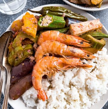 Finish dish of ginisang gulay with shrimp in a plate on the table.