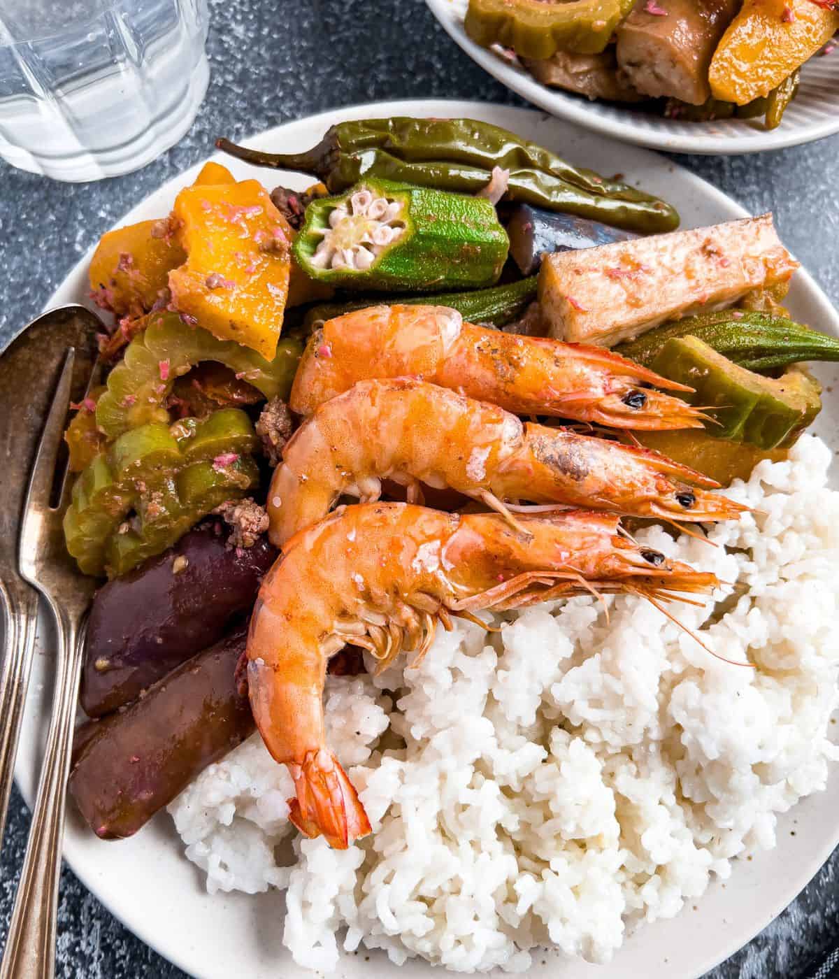 Finish dish of ginisang gulay with shrimp in a plate on the table.