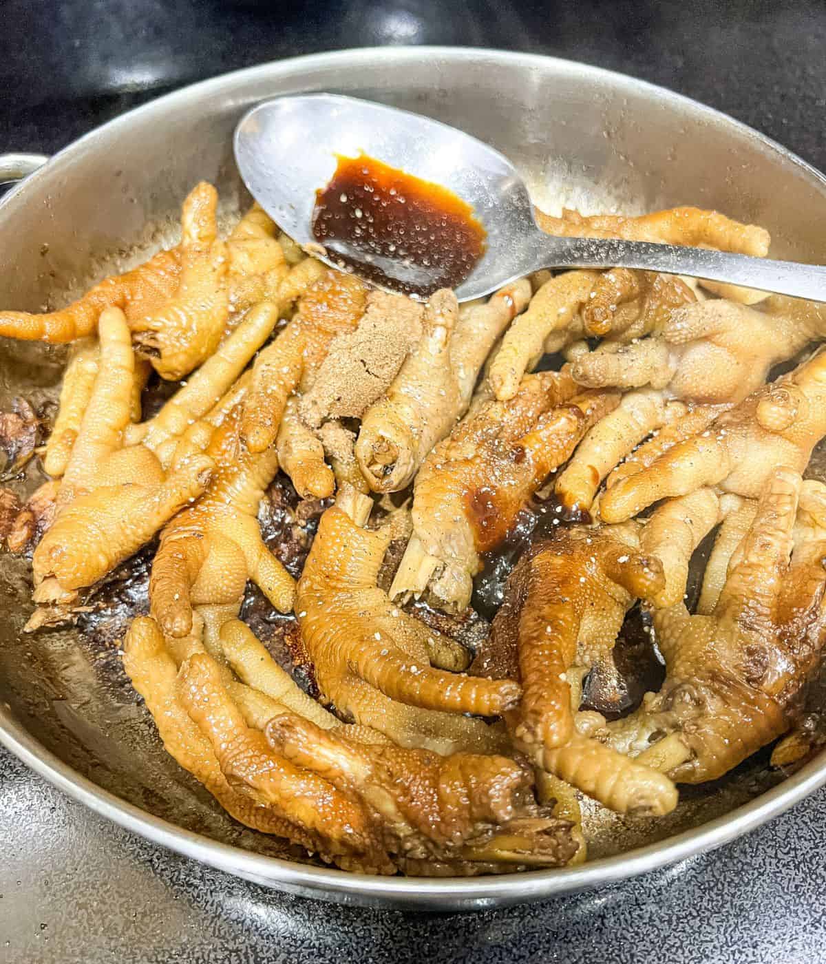 Adding soy sauce, oyster sauce, and brown sugar.