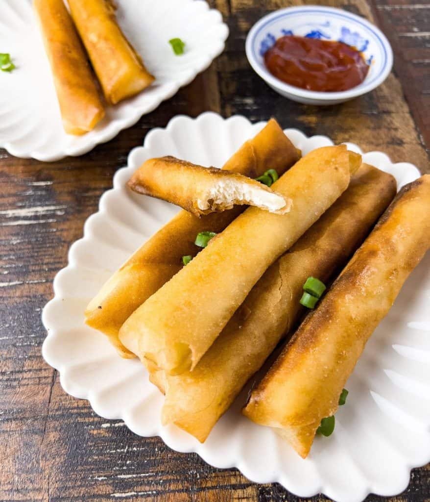 Finish dish of cheese lumpia with a bite.