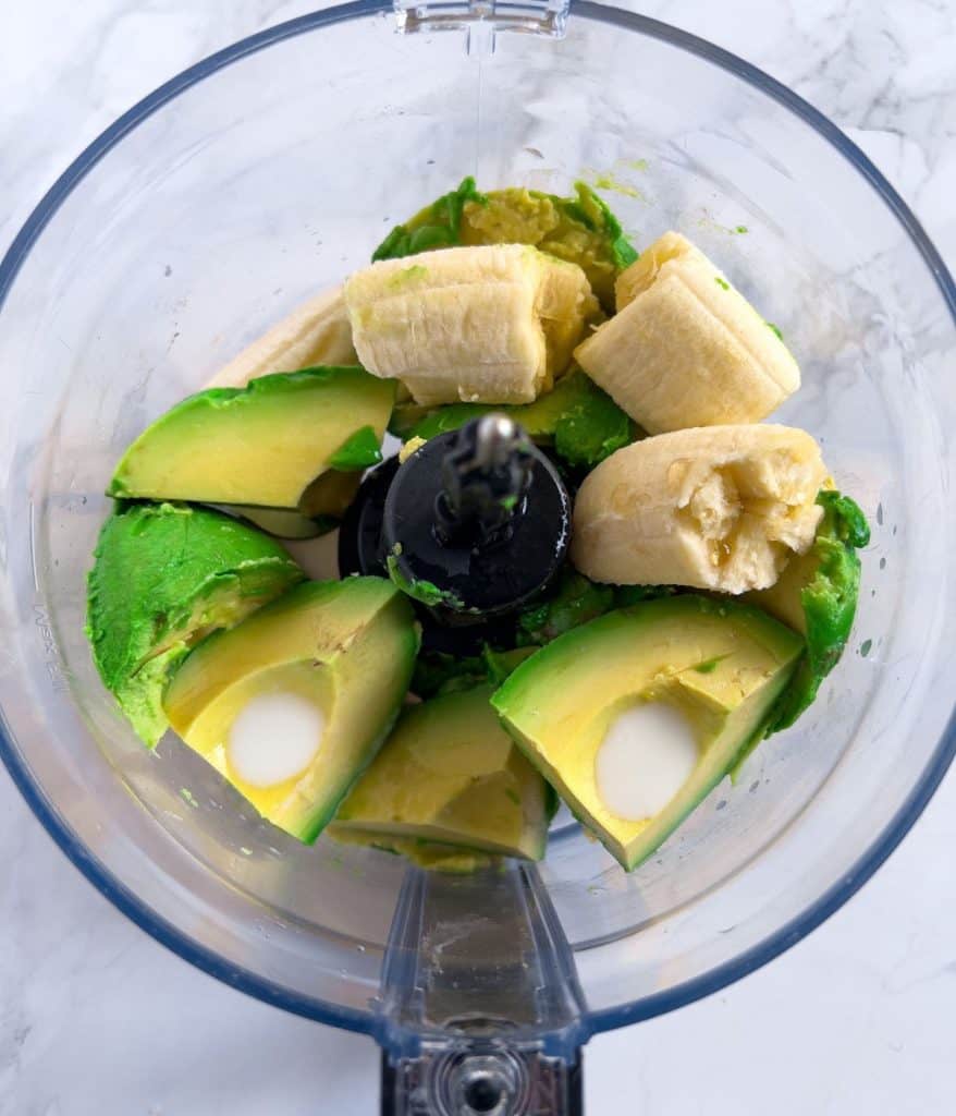 Ingredients for avocado nice cream in a food processor.