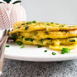 Finish dish of keto green onion pancake with egg in a plate.